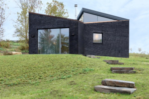 a home designed by GRT architects in black brick
