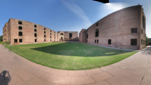 panorama of brick buildings around a lawn at Indian Institute of Management Ahmedabad