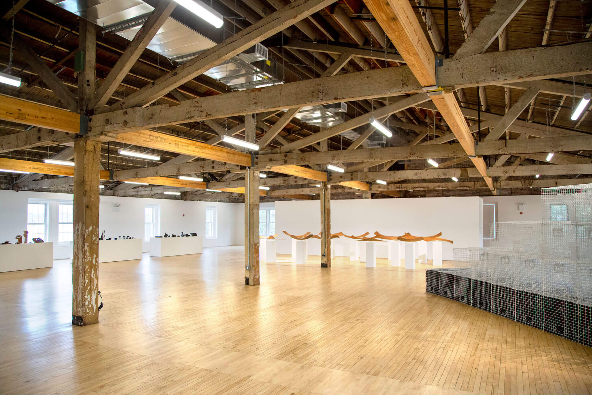 Interior of a renovated arts space with exposed trusses