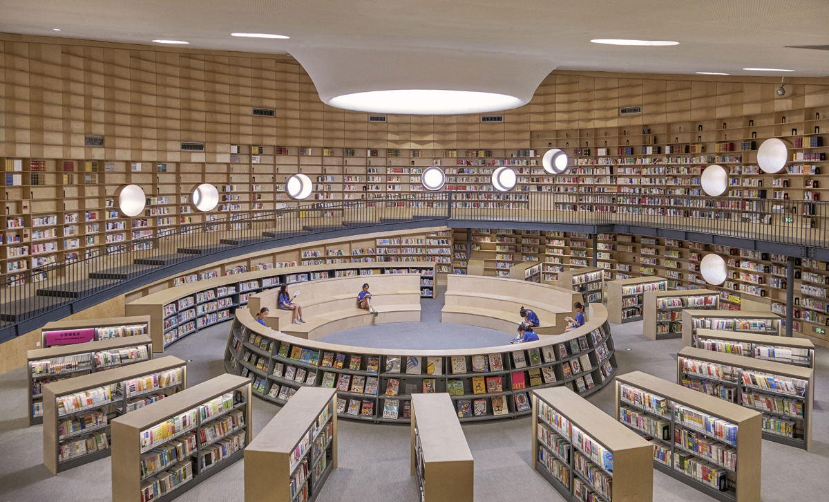 a large reading room in a library with an oculus skylight