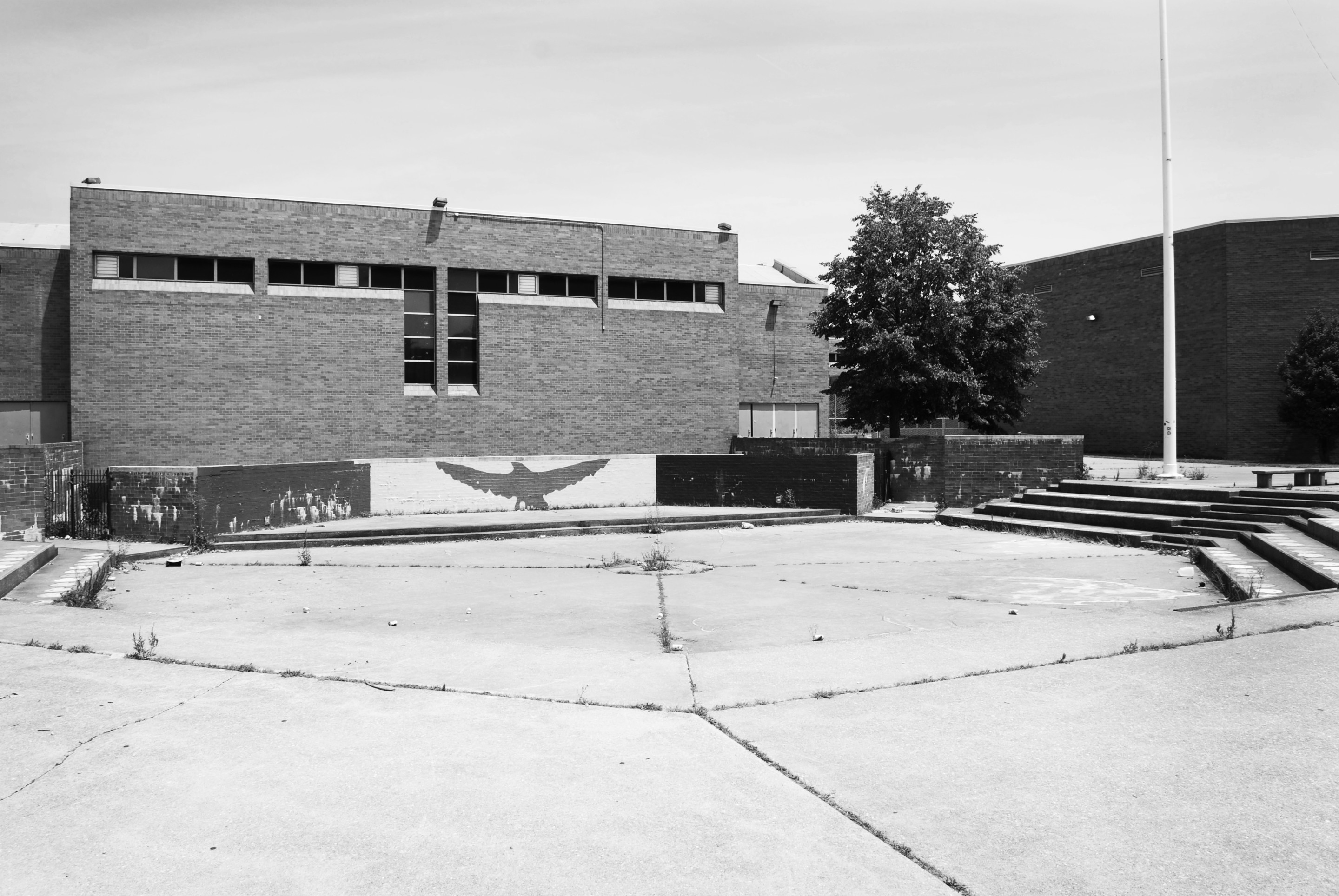 A black and white photo of a now demolished brutalist middle school