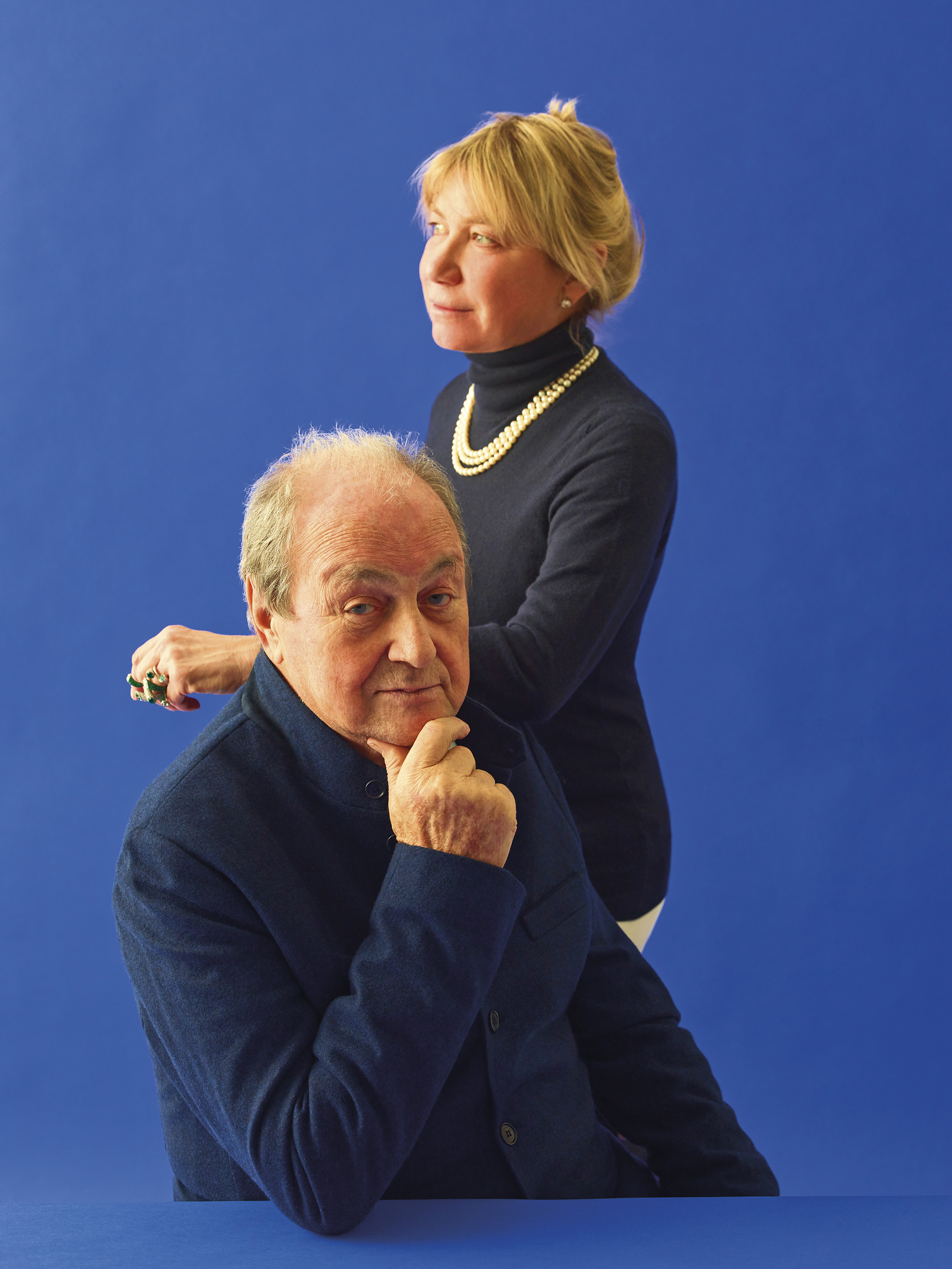 a man and woman on a blue background
