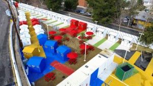 aerial view of brightly colored bridge housing community
