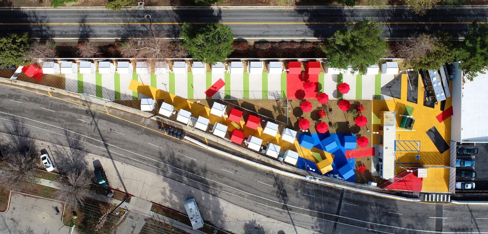 aerial view of brightly colored tiny house community