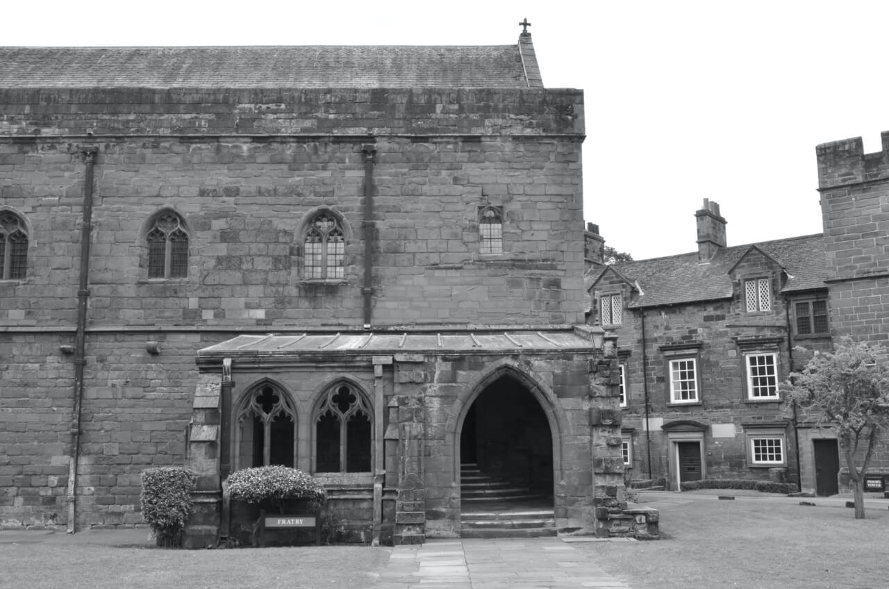 historic black and white photo of the sandstone Carlisle Cathedral