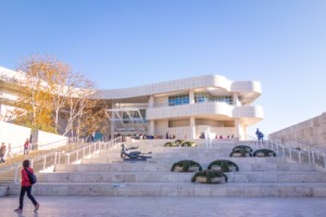 the getty center, a white blobby building with an occupied staircase in front