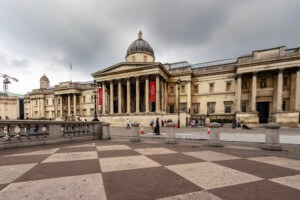 Front of the national gallery in london with red banners to that effect