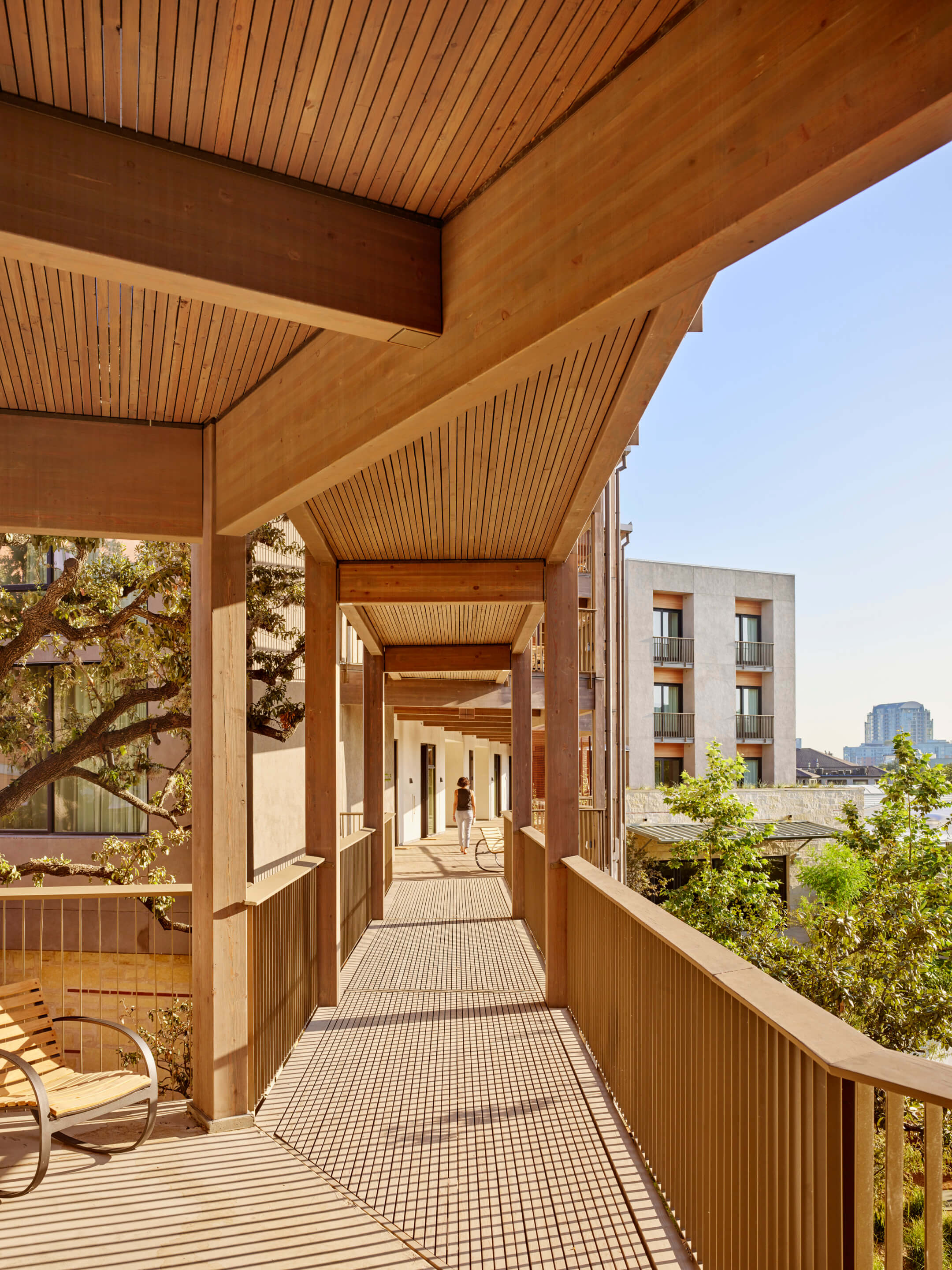 Vertical photo of a hotel with timber flooring and walkways