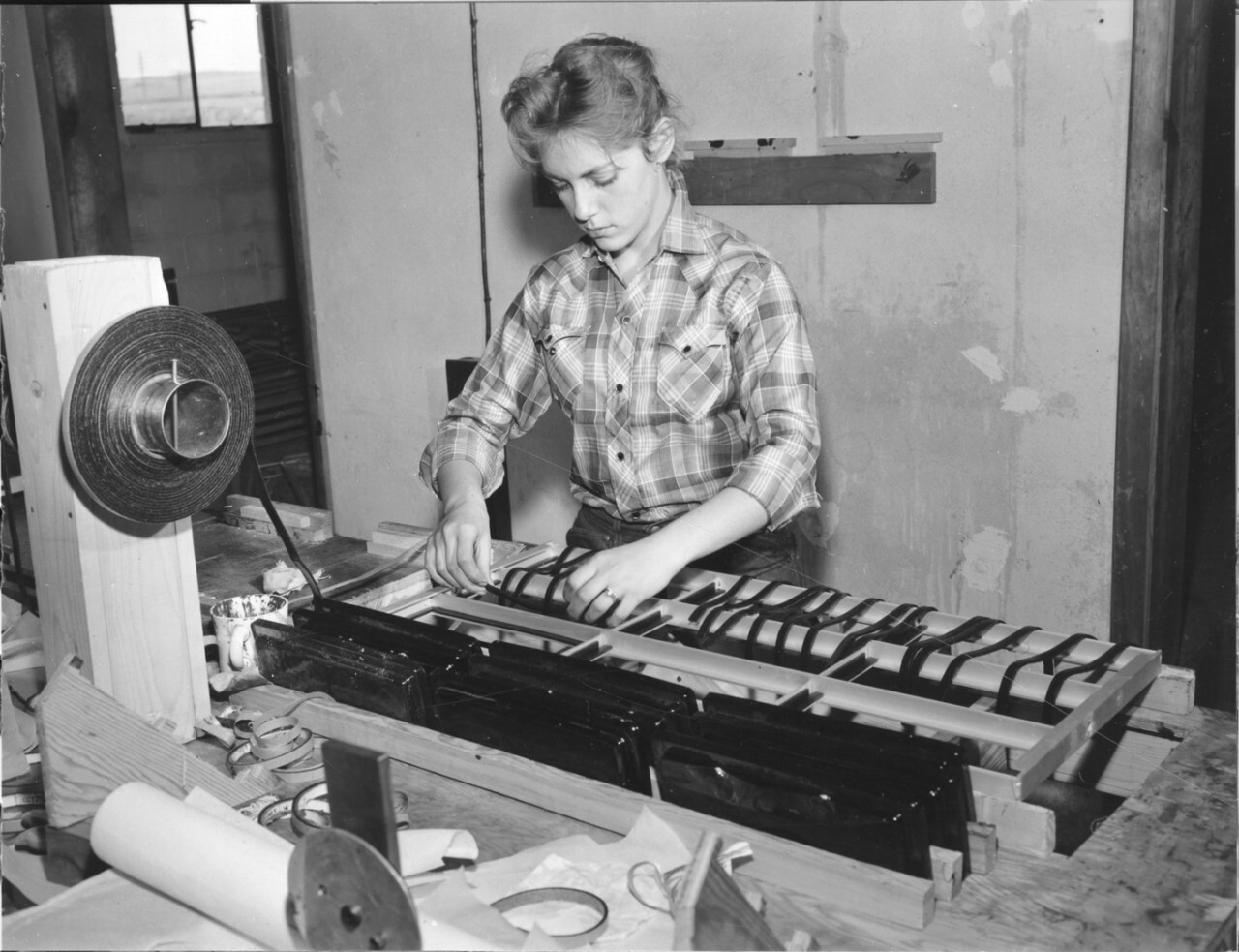 a woman assembling stained glass