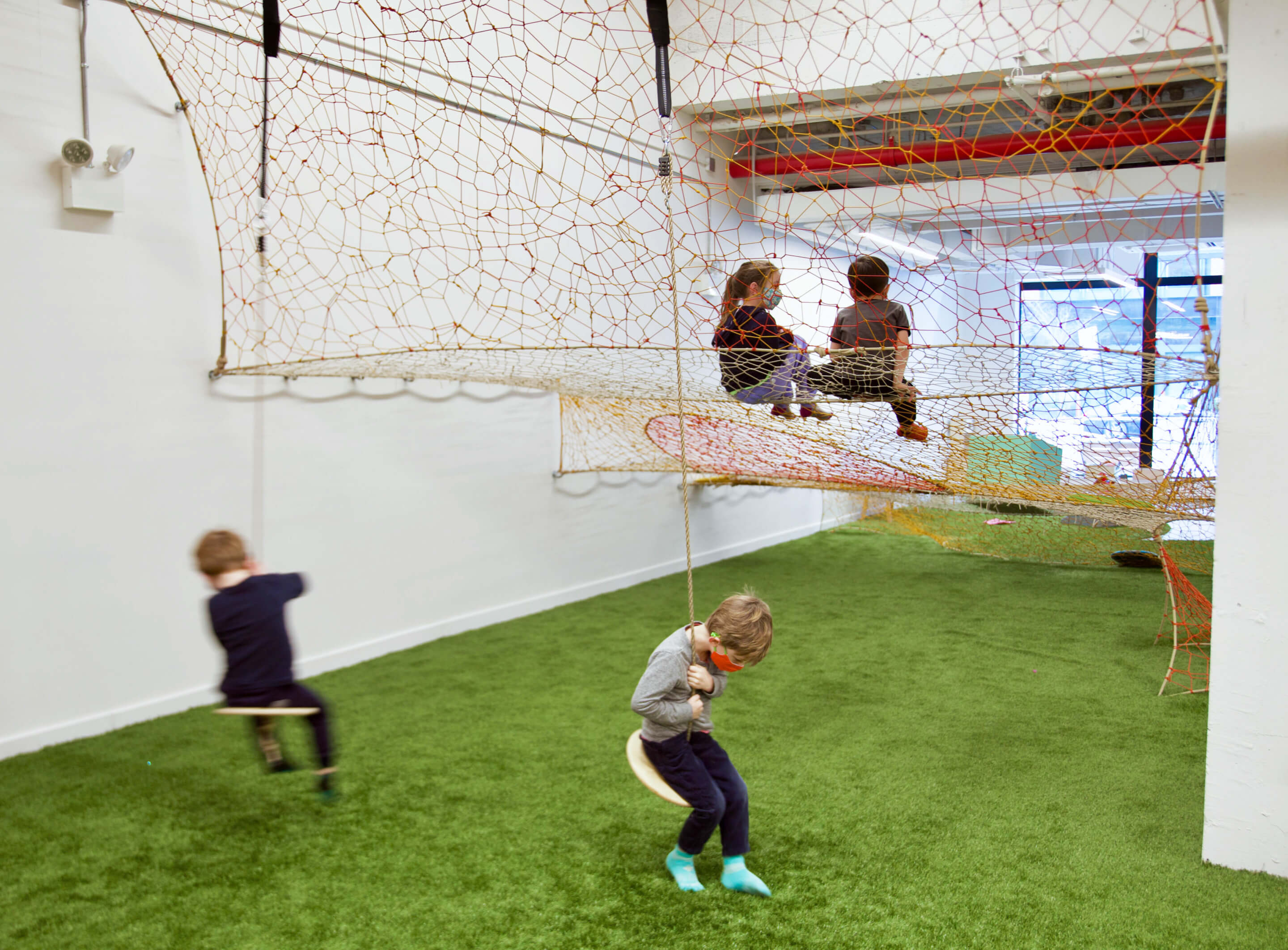 children playing on a rope stepper