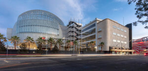 photograph depicting a new Los Angeles museum with oversized glass dome and staircase at center
