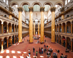 a columned great hall in a historic building inside the national building museum
