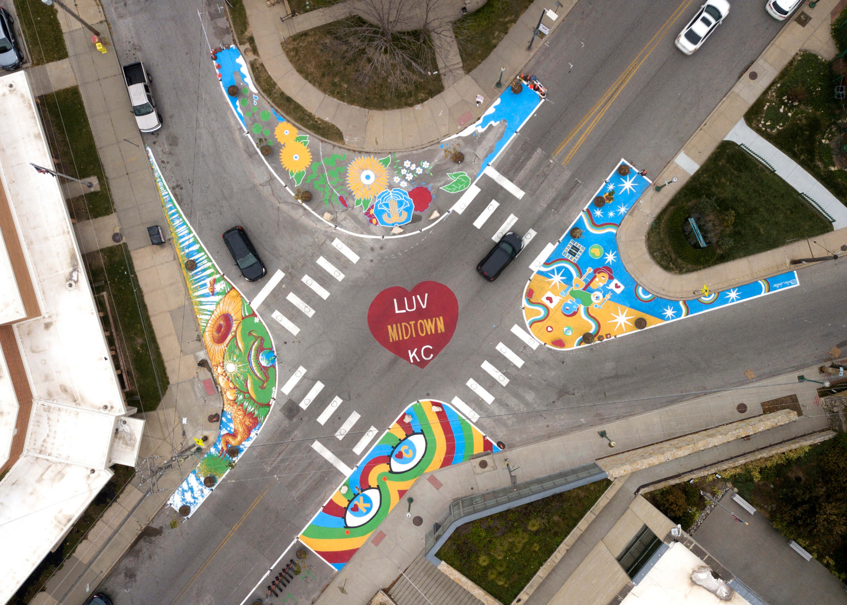 aerial view of a colorful mural at a busy intersection