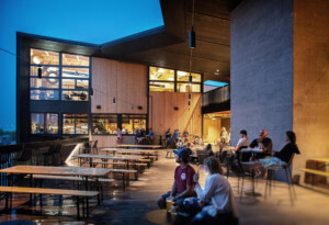 people congregating outside at a mass timber building