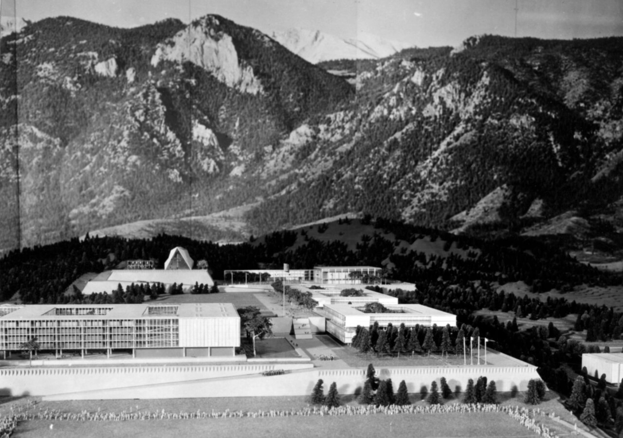 a scale model of an air force facility amid a mountain backdrop