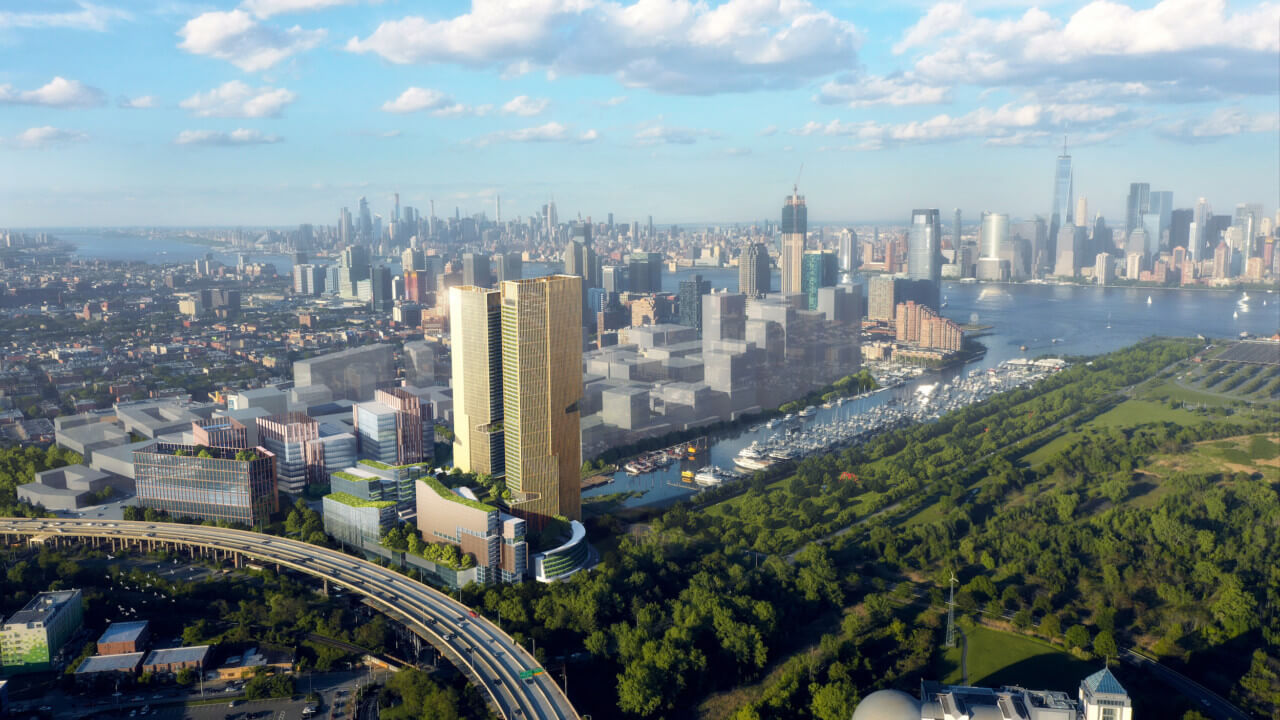 aerial view of a cluster of planned building opposite the manhattan skyline