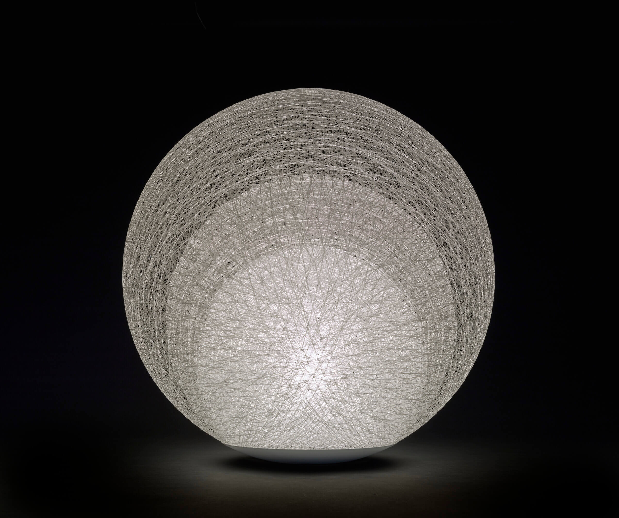 Photo of a white globular lamp with nested layers