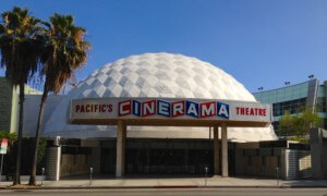 a movie theater with geodesic dome and cinerama sign