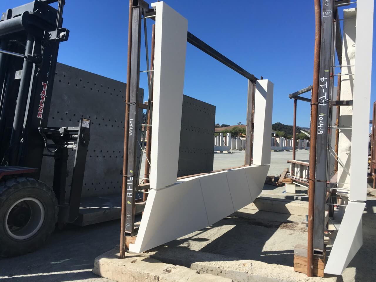 A typical panel on site at Willis Construction plant before window installation, with the steel tube across the top of the GFRC panel assembly