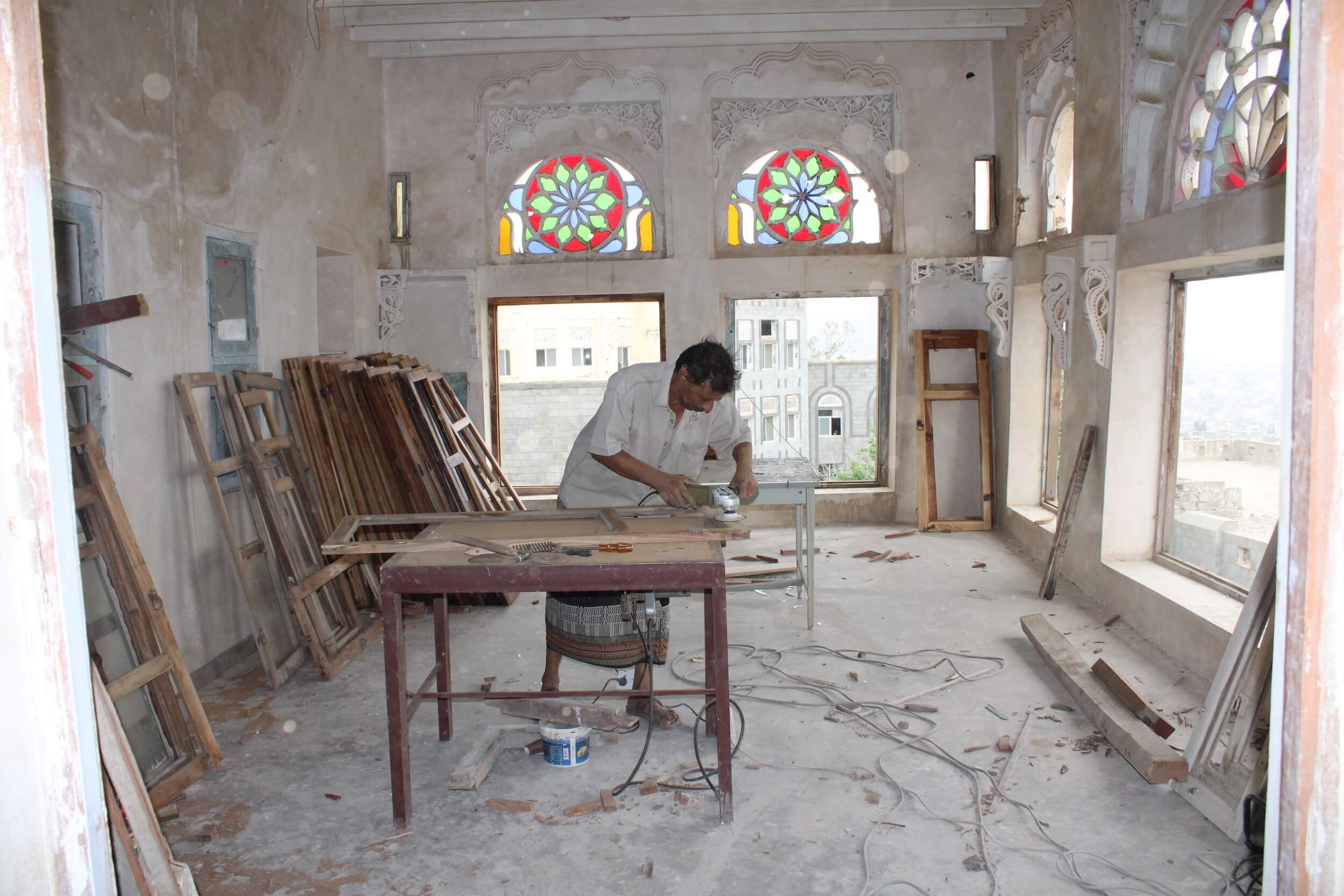 restoration work in a historic palace with stained glass