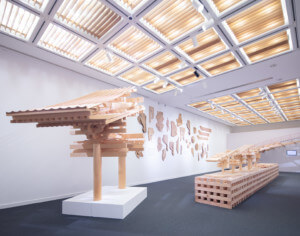 Interior exhibition photo of a timber gallery show at the japan society