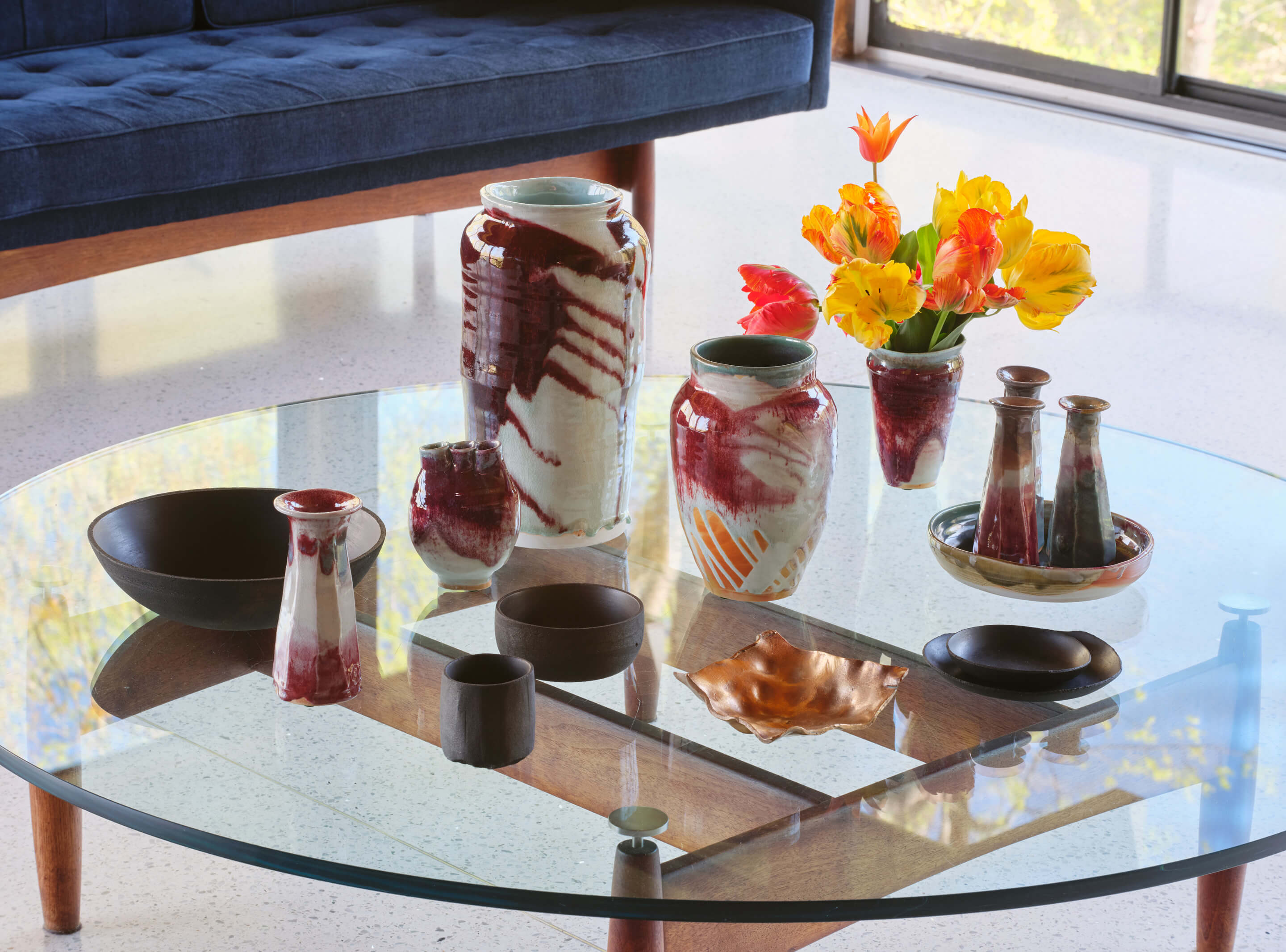 red and white ceramic vessels on a table