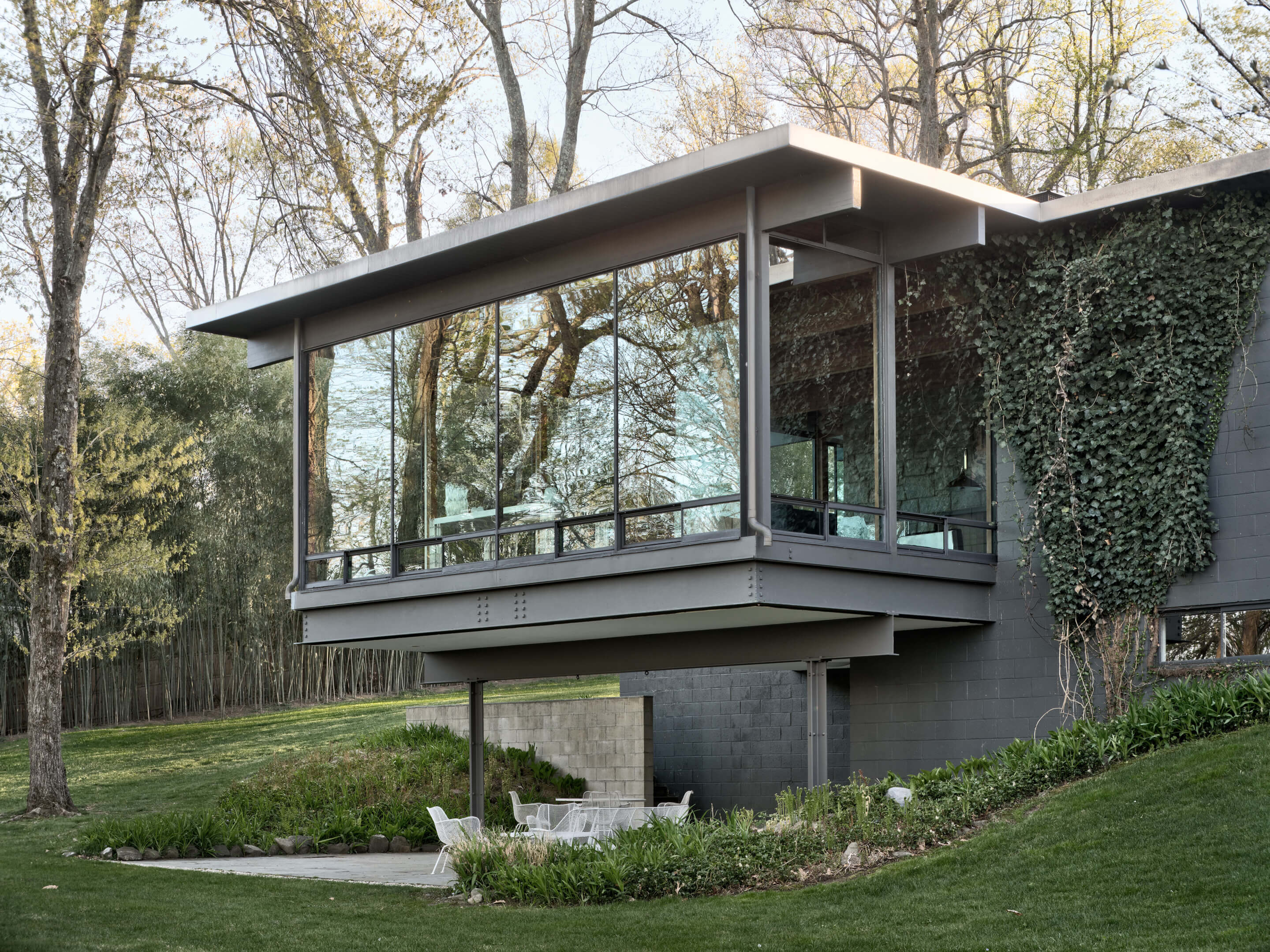 Exterior shot of a cantilevering glass volume