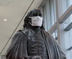 statue of benjamin franklin wearing a face mask, one of the potential National Garden of American Heroes nominees