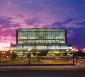 a library building with a glazed facade during dusk