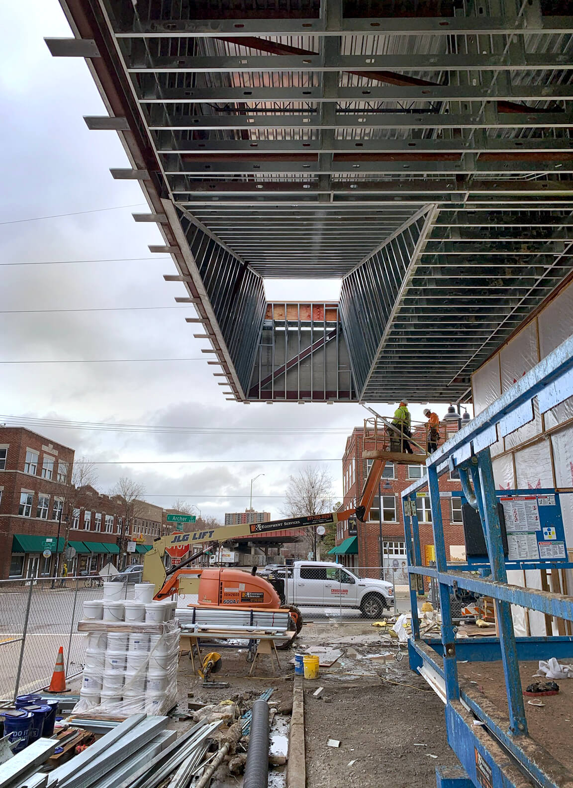 construction view of a building's cantilevered roof as greenwood rising is built