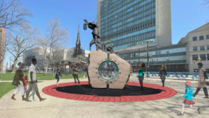 rendering of a memorial to harriet tubman in front of a downtown high-rise