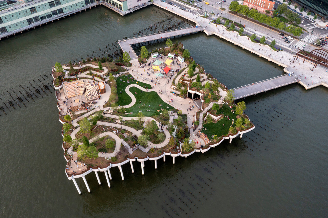 Little island, a square landscape supported on concrete piers, juts out from 11th avenue into the river