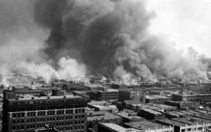 historic photo of a neighborhood on fire