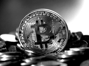 A bitcoin in black and white