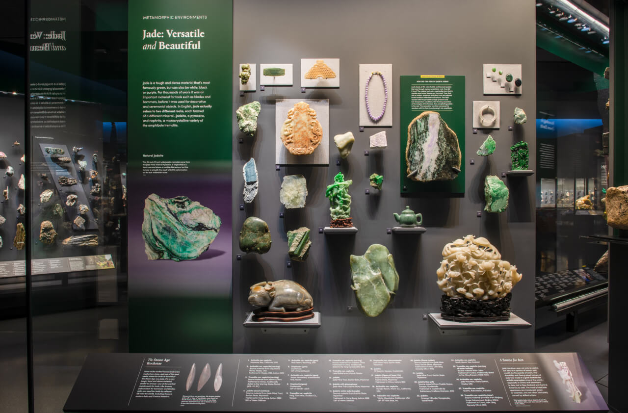 a collection of jade on display in a case