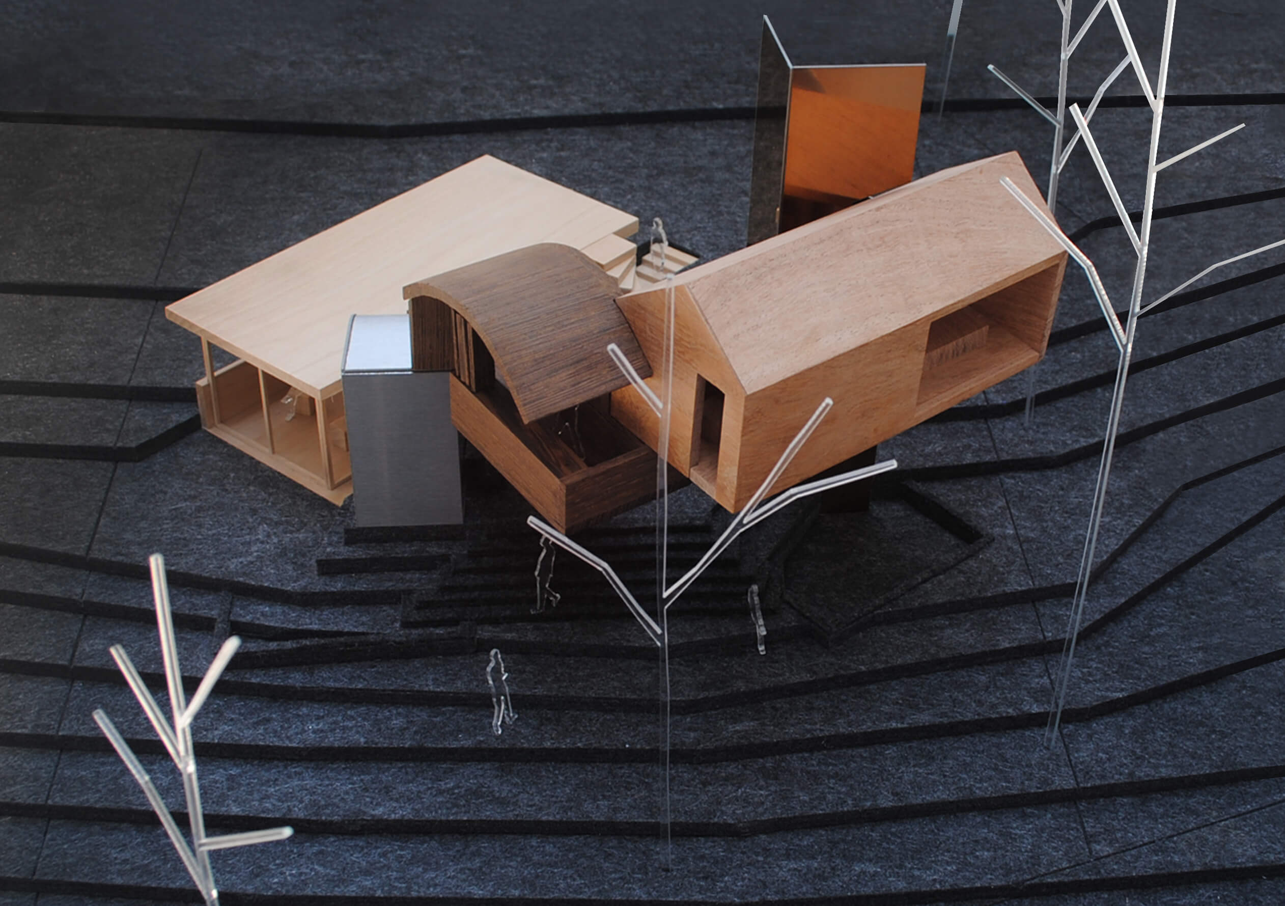 A model of intersecting houses by a tree from tatiana bilbao ESTUDIO