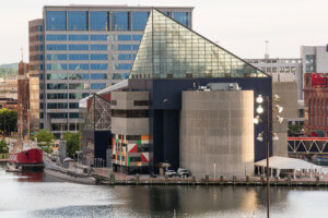 The national aquarium in baltimore, with a jutting triangular glass topper