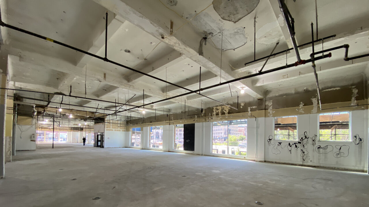 Inside of a gutted warehouse with coffered ceilings