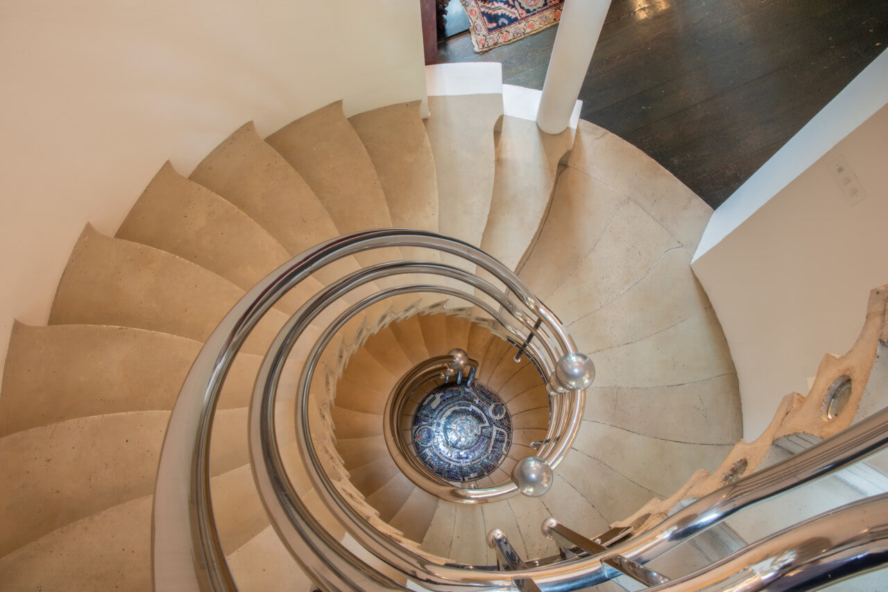 Looking down a spiral staircase in the cosmic house