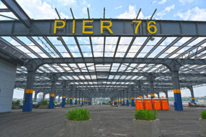 a big steel framework and sign that reads pier 76