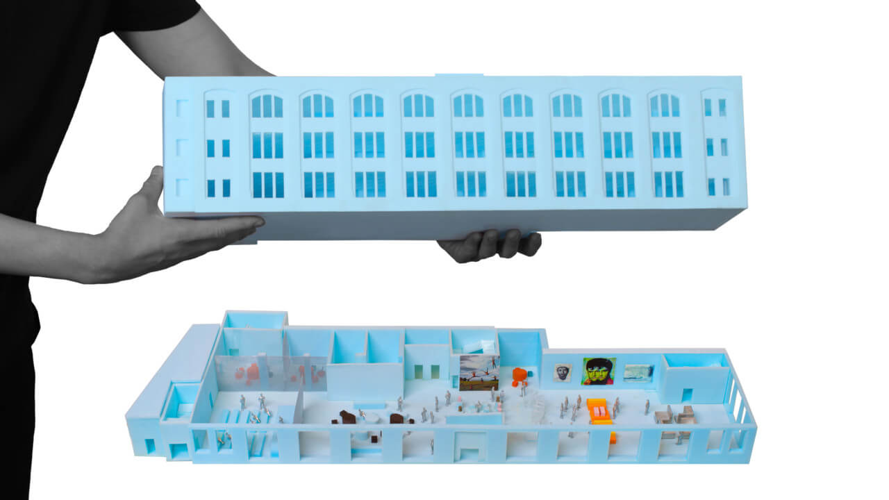 Model of a long repurposed warehouse in blue foam