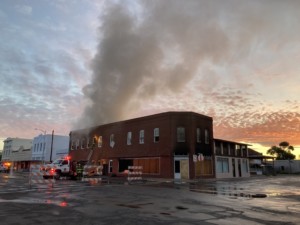 smoke emerging from a two-story building