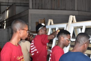 Tuskegee students working on window frame