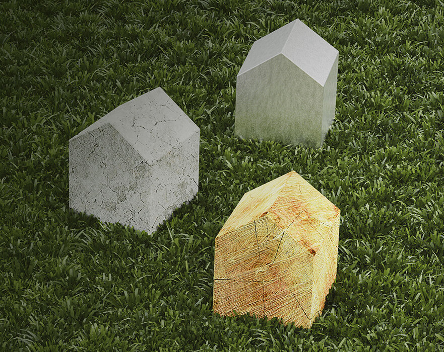 photograph of house-shaped blocks on grass