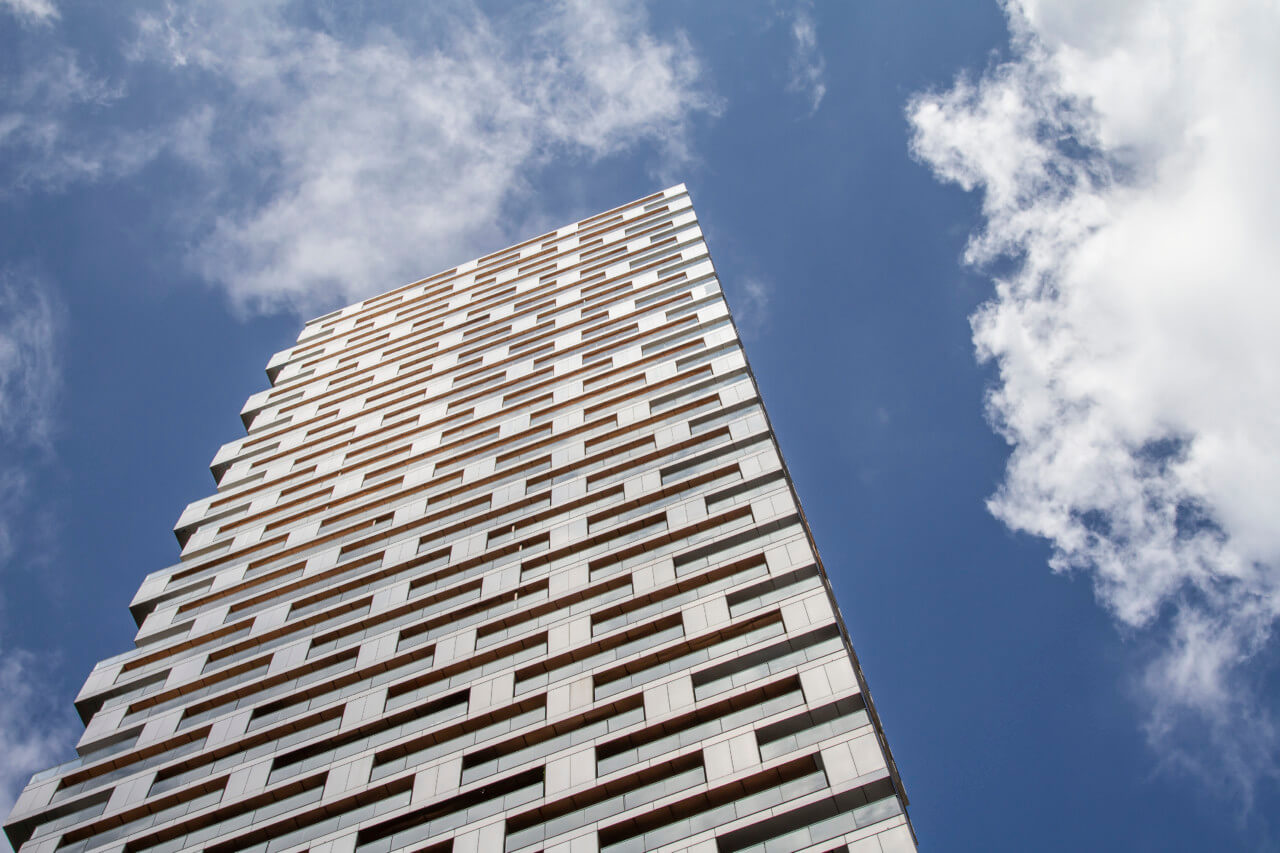 Looking up at the alternating stainless steel facade of vancouver house