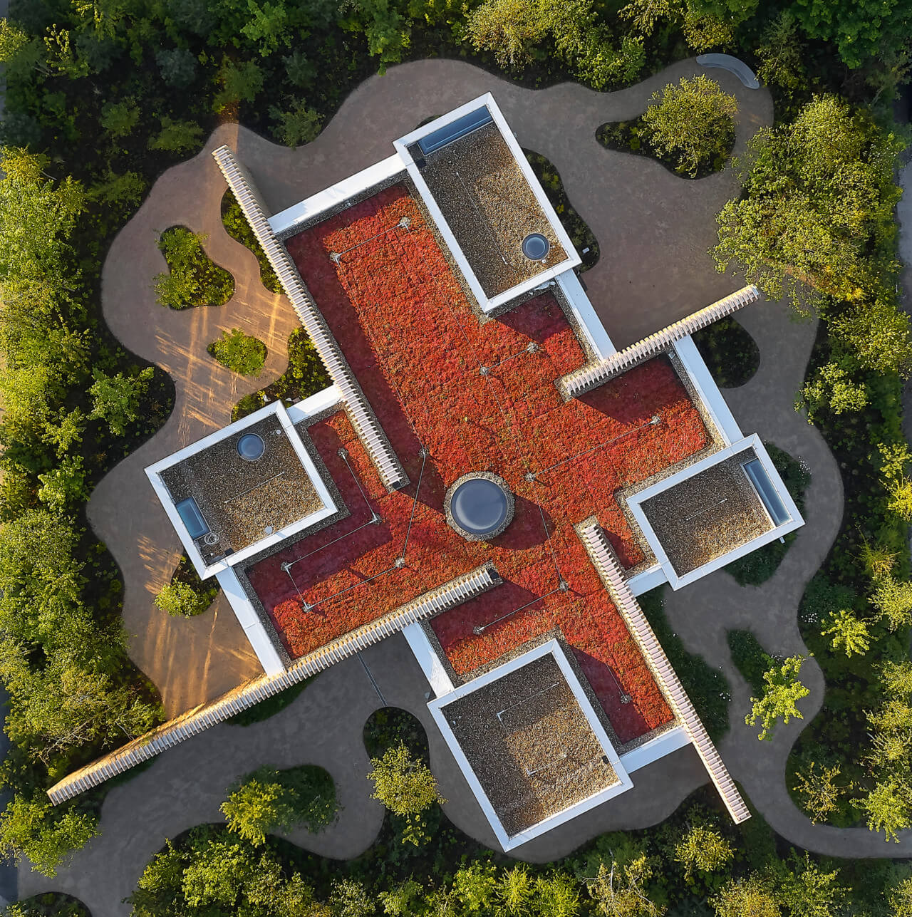 aerial photo of a pinwheel shaped building