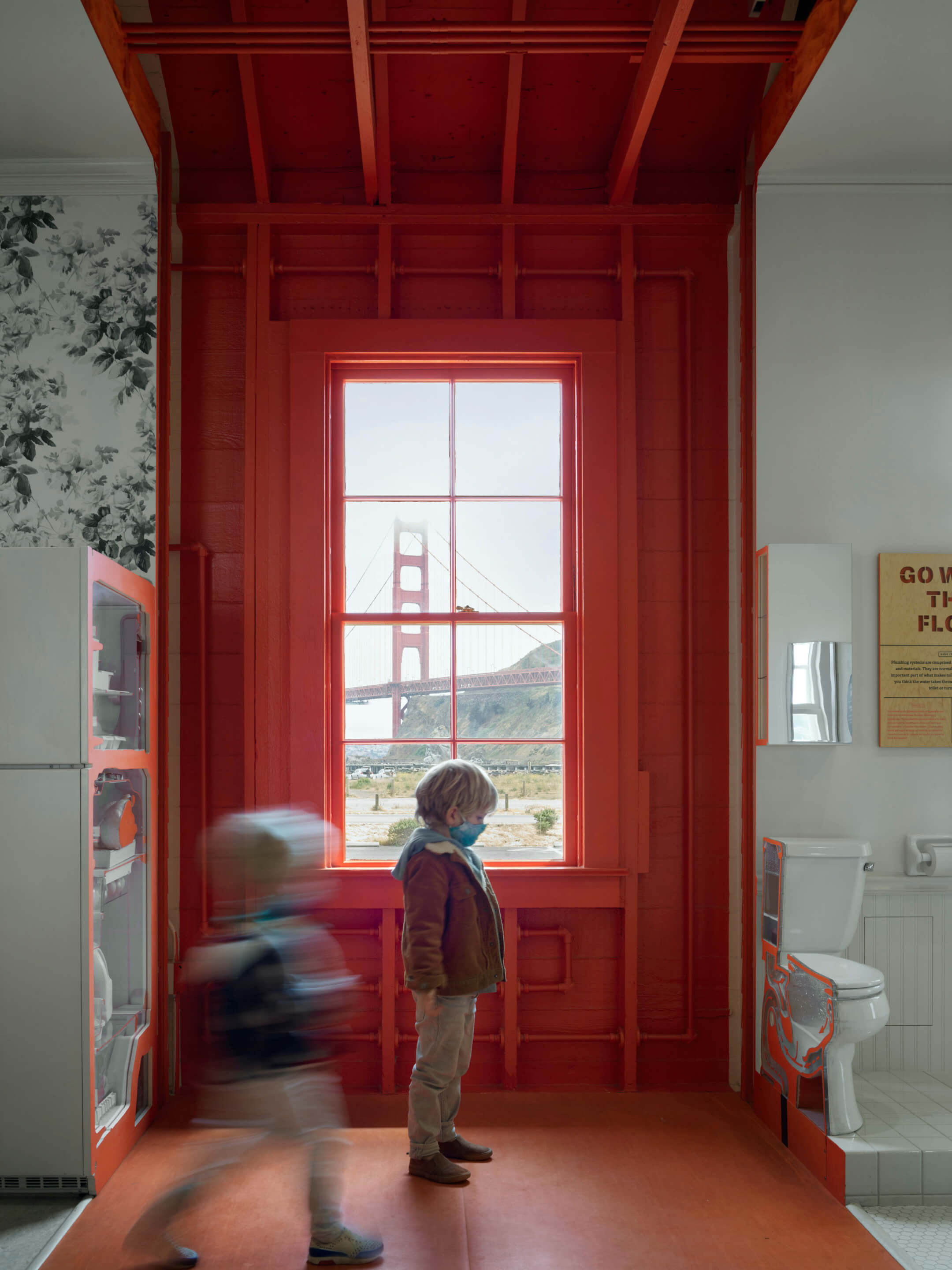 children exploring an interactive museum with the golden gate bridge in the background