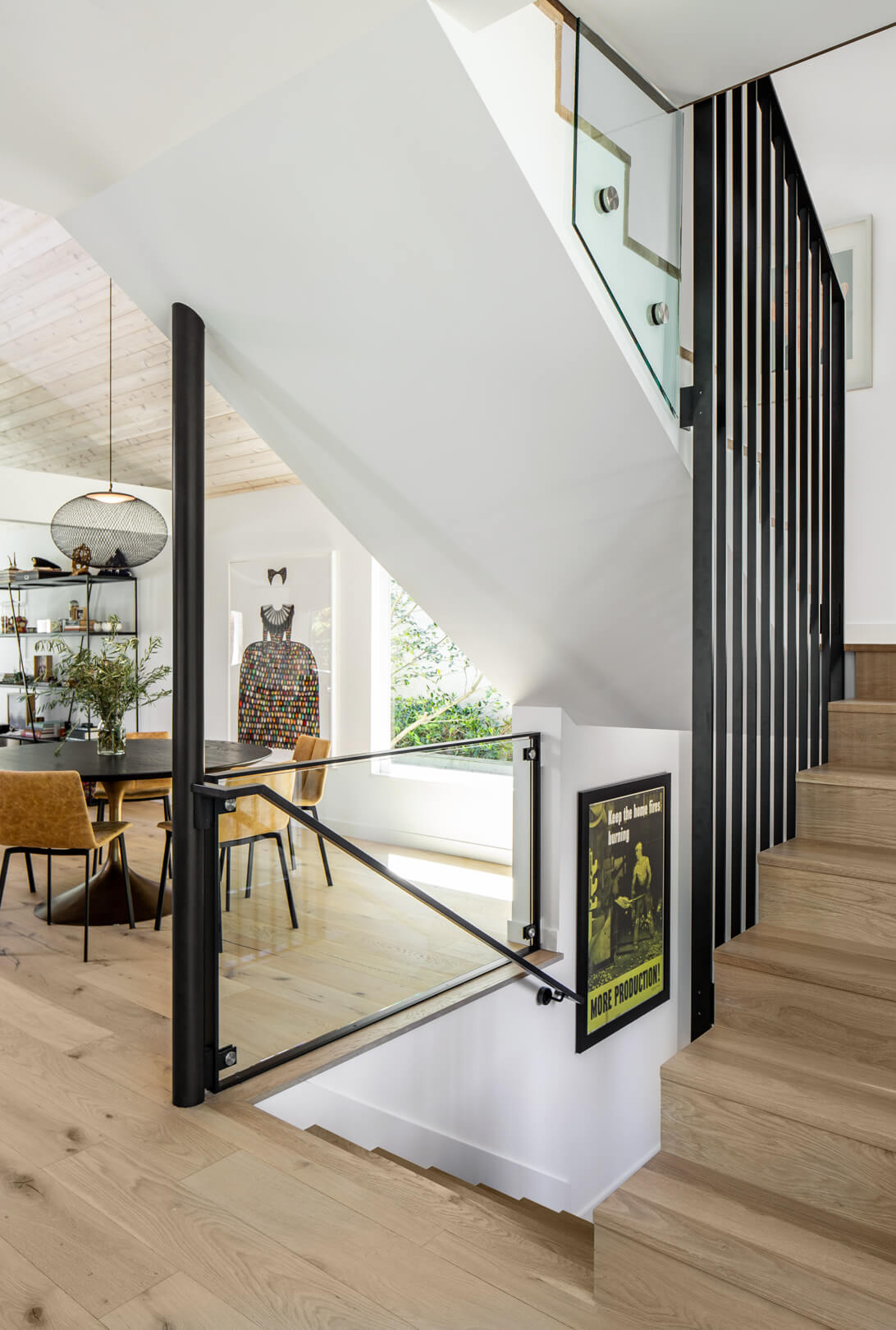 a steel staircase in a modern, bright living space newly renovated by best practice