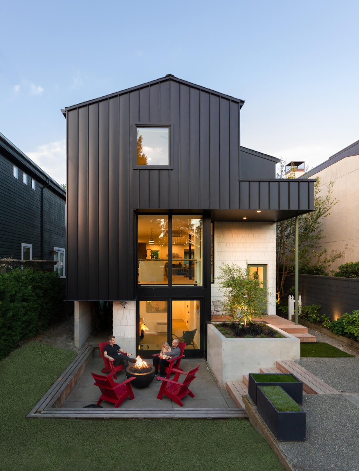 a metal-clad addition and yard at the rear of a home redesigned by best practice