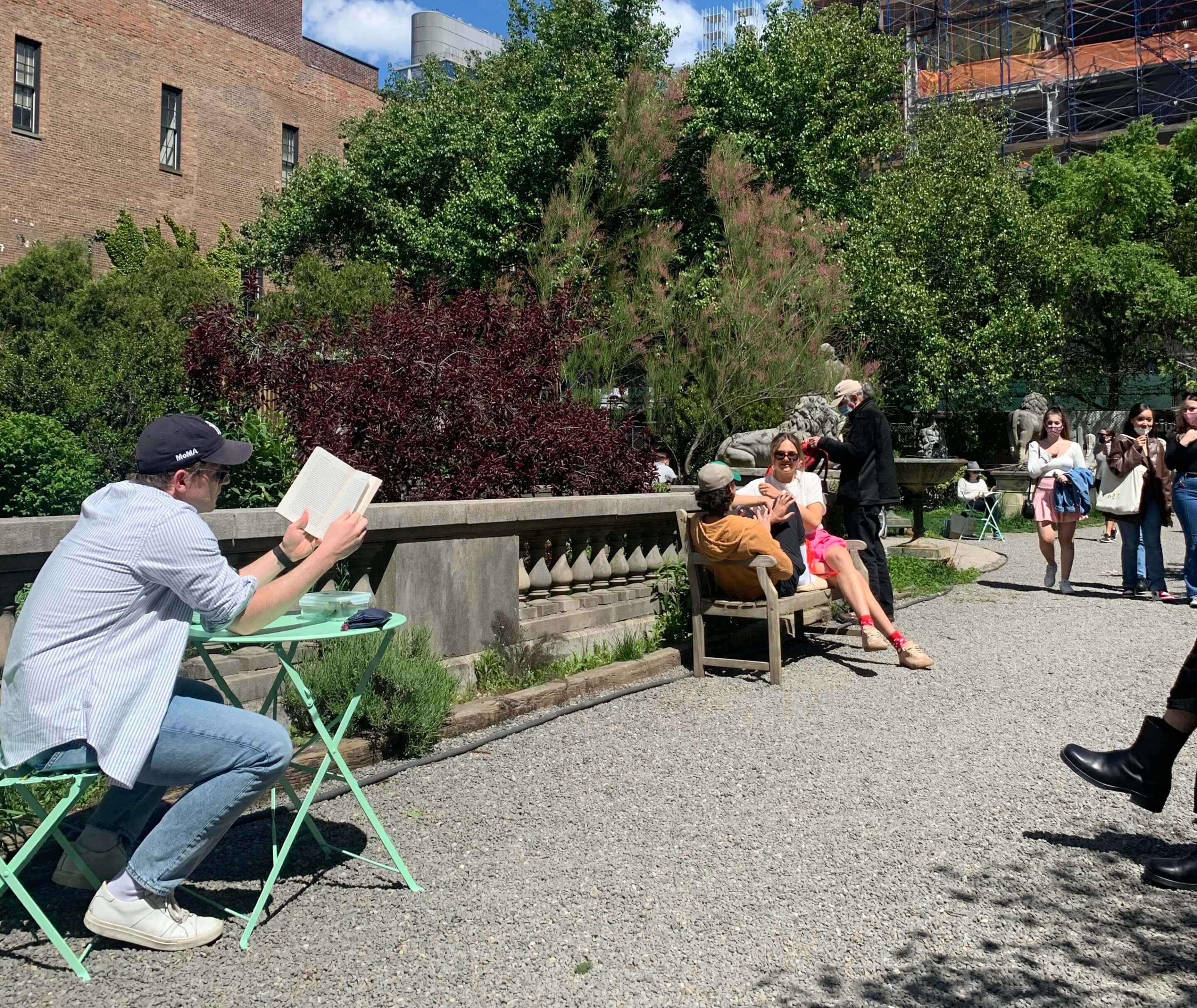 People sitting and reading in elizabeth street garden